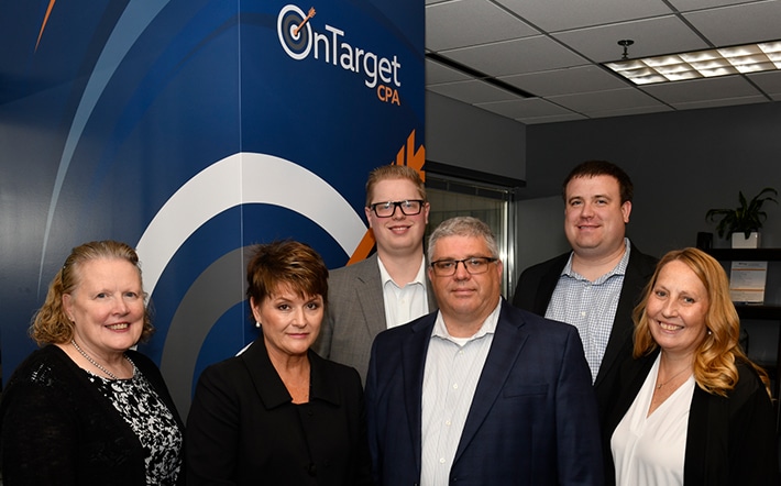 Group photo of OnTarget management team